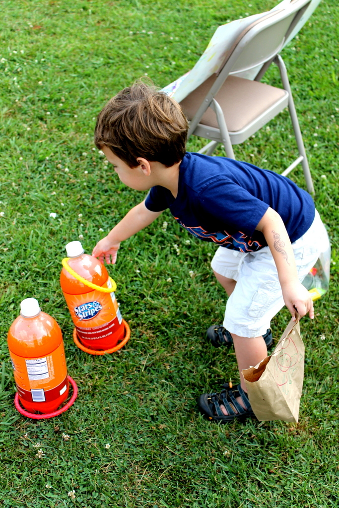 Toddler ring toss with soda bottles